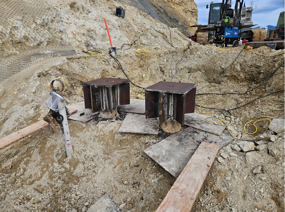 A metal like micro pile sticking out of the ground.