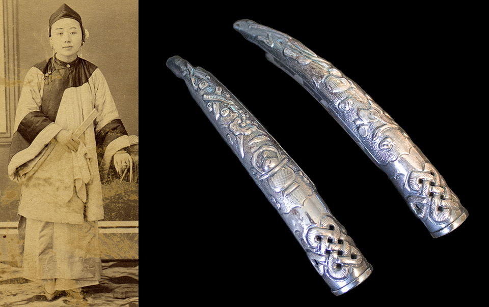 Chinese woman wearing silver fingernail guards.