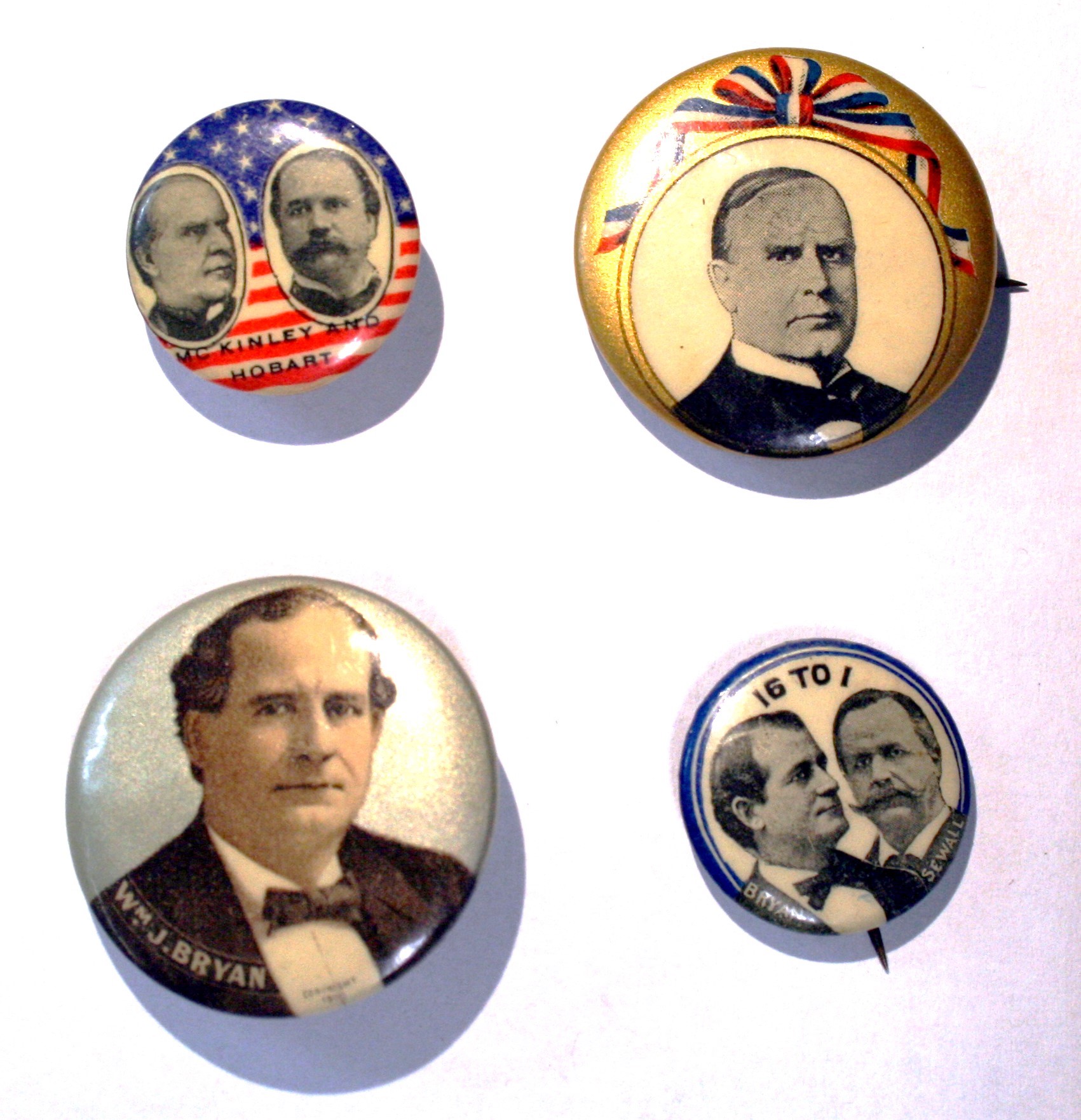 four campaign buttons
