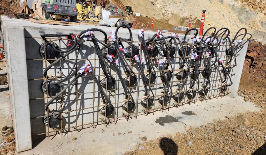 A large cement abutment fixed with rebar and grout.