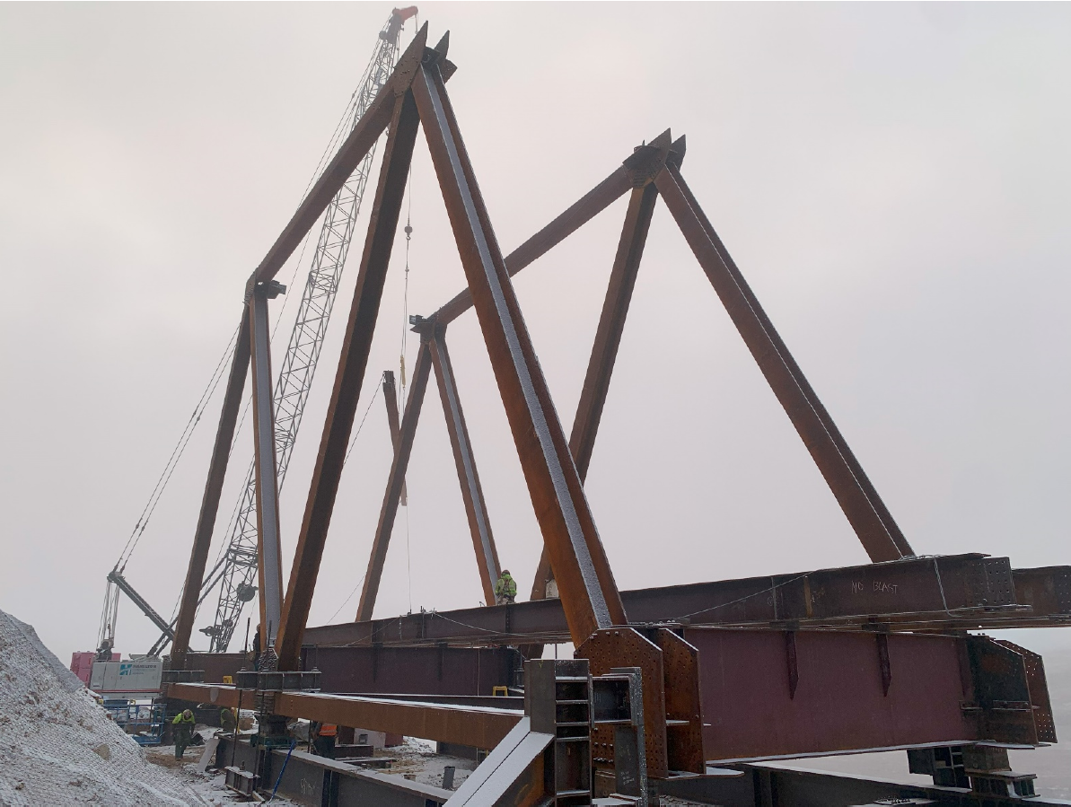 A portion of a steel bridge erected on top of a steel launch platform