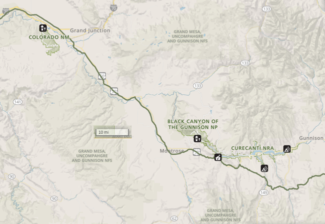 A map of Colorado near Montrose. The map depicts a road traveling from east to west, and then north to Grand Junction. There is a linear feature indicating the presence of the Old Spanish trail along this route.