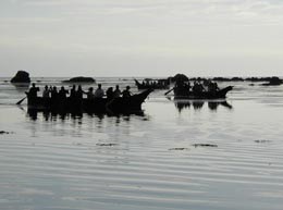 Two canoes out in the water at the start of the 2002 tribal journey