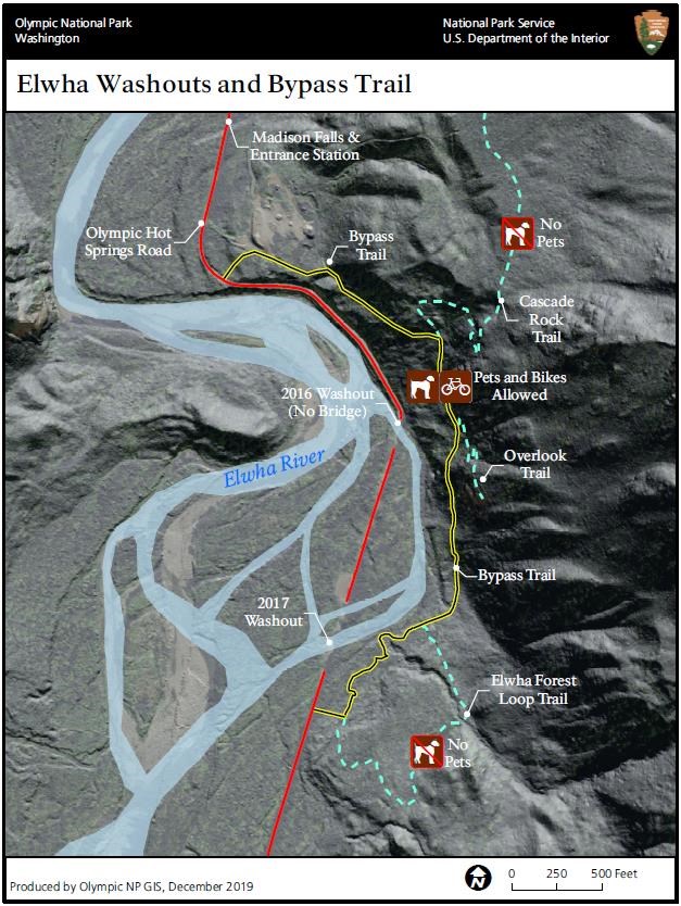 A map of a river valley, the braided water labeled Elwha River. Trails along the river include a bypass trail, labled Pets and Bikes Allowed, and a bypass trail further from the water, labeled "No Pets"