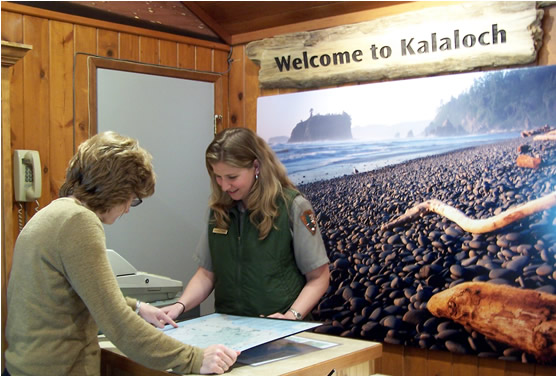 female ranger showing a map to visitor