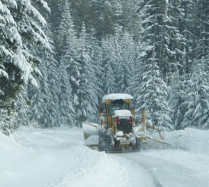Plows work hard clearing snow on the road to Hurricane Ridge.