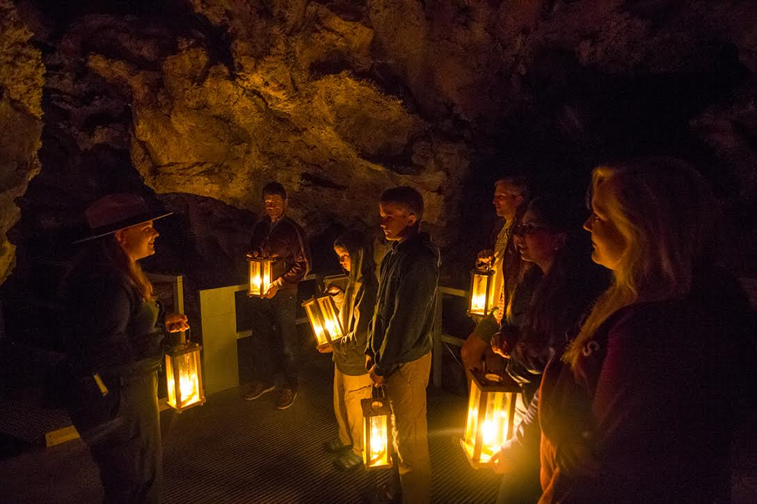 Tour group participating in a candlelight tour