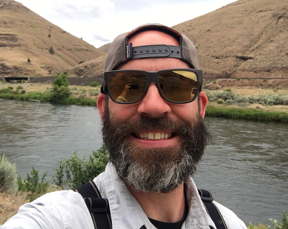 Jeremy Hobson with river and hills in background.