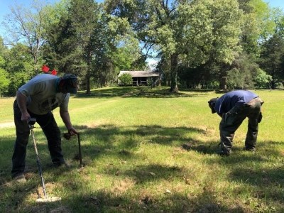 SEAC archeologists using metal detectors at a historic home