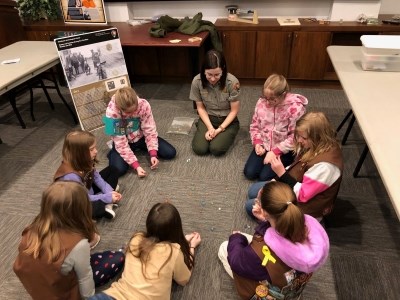 NPS Park Ranger speaks with a Girl Scout Troop