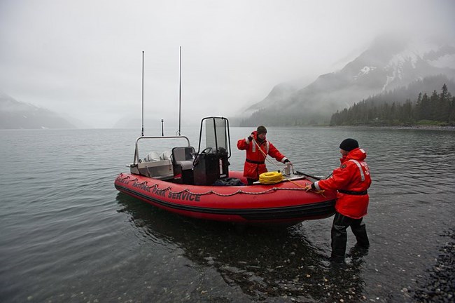 nps employees dock a boat