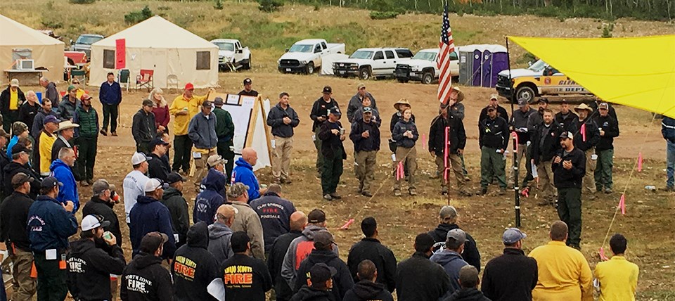 Firefighters gather for the morning briefing during the Fuller Fire.