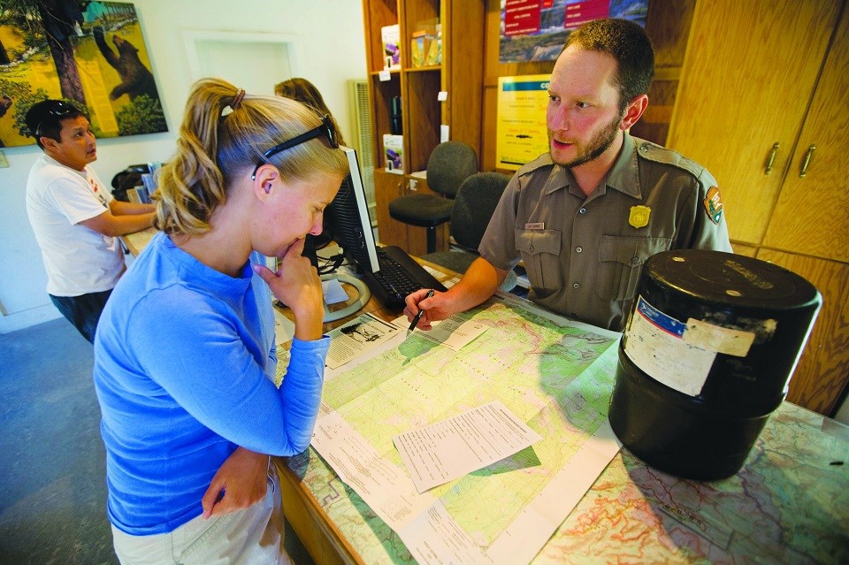 Visitor and ranger discuss trip planning options
