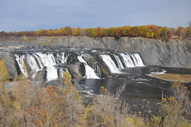 Water rushes over steep rock faces at Cohoes Falls, New York, located within the within the Erie Canalway National Heritage Corridor and Maurice D. Hinchey Hudson River Valley National Heritage Area.