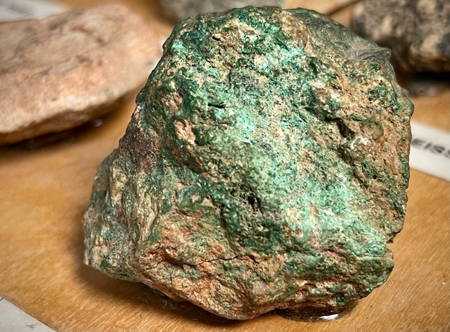 A piece of ore containing green malachite.