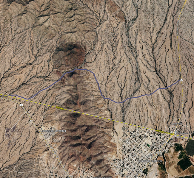 Satellite map of South Puerto Blanco Drive with overlaid line highlighting the location of the ongoing construction