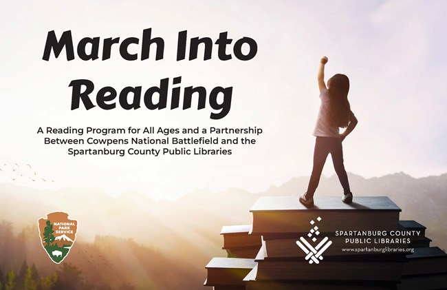 Child stands on stack of books with arm rasied in air