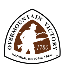 Brown convex triangle with silhouette of a man and mountains