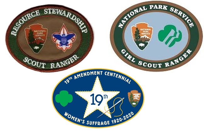 Group of Scout Patches - a brown resource stewardship badge with the NPS arrowhead & boy scout eagle, a light blue badge with the NPS arrowhead "pair of faces" girl scout logo, & a blue 19th Amendment patch with a five-point star, needle, & thread