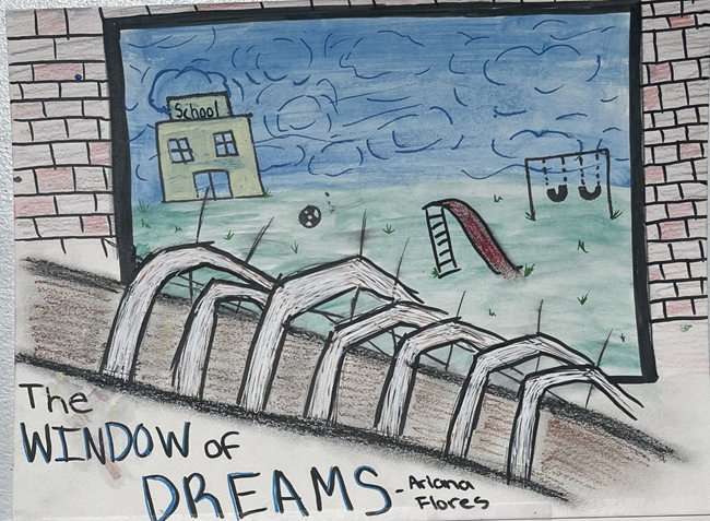 a school with a play ground in the background with a window filled with silk in the foreground