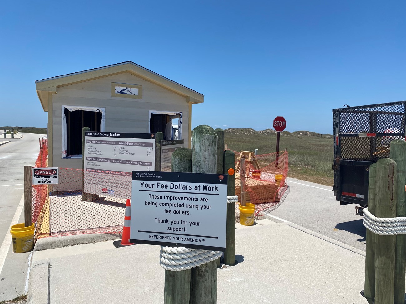 A small building under construction with caution tape around