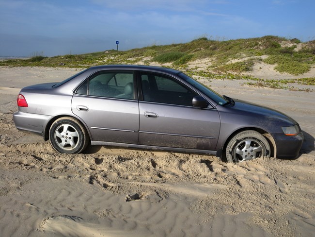 Car stuck in soft sand on South Beach