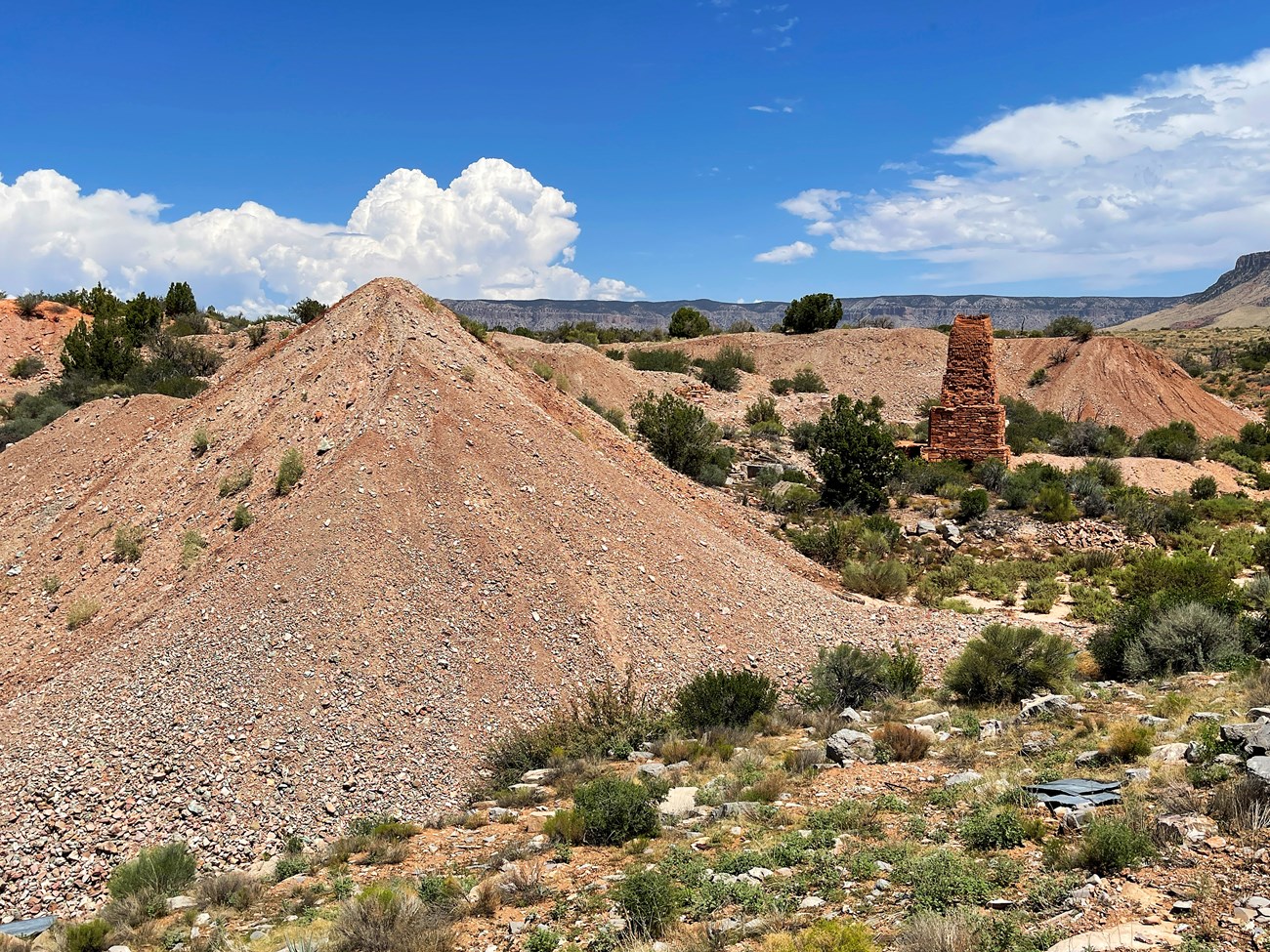 Ore piles and smelter chimney