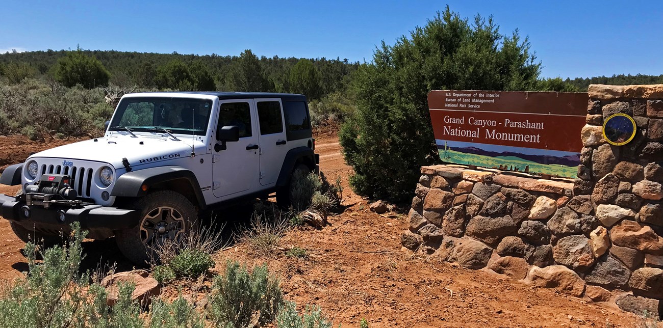 Jeep at monument entrance sign