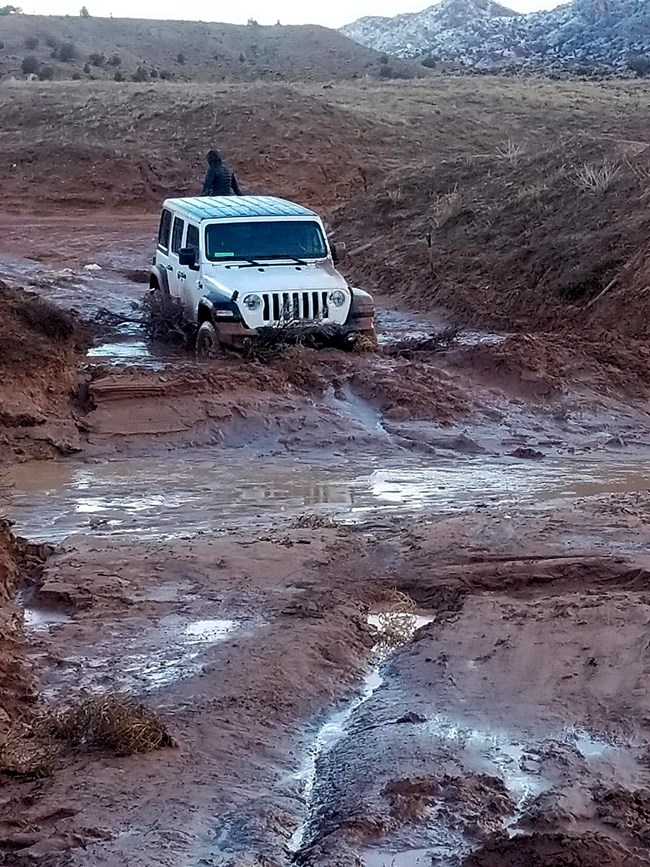 Jeep stuck in mud BLM photo
