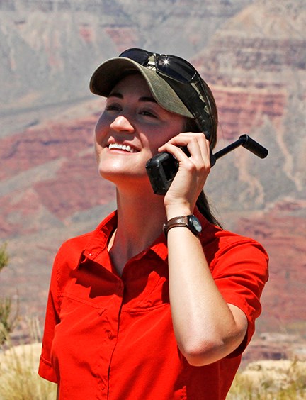 Visitor using a satellite phone