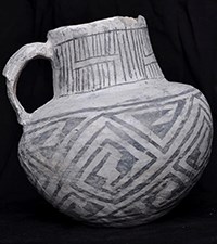 Ceramic jug with black-on-white designs