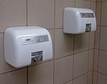 hand dryers attached to wall
