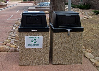 side by side trash and recycling receptacles