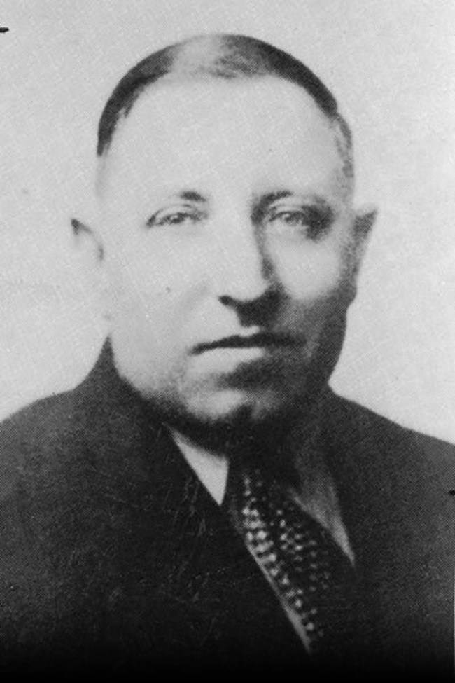Black and white head image of a clean shaven man, named Henry Gerber