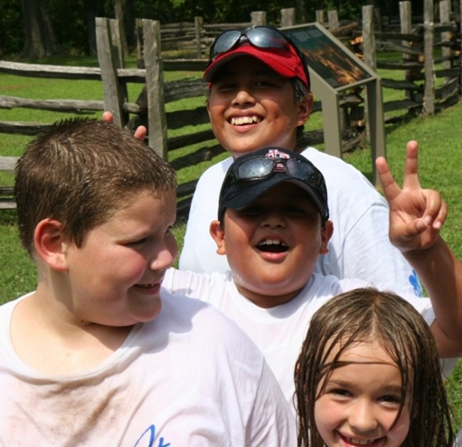 Kids having fun at an event in the park.