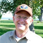 A smiling male volunteer