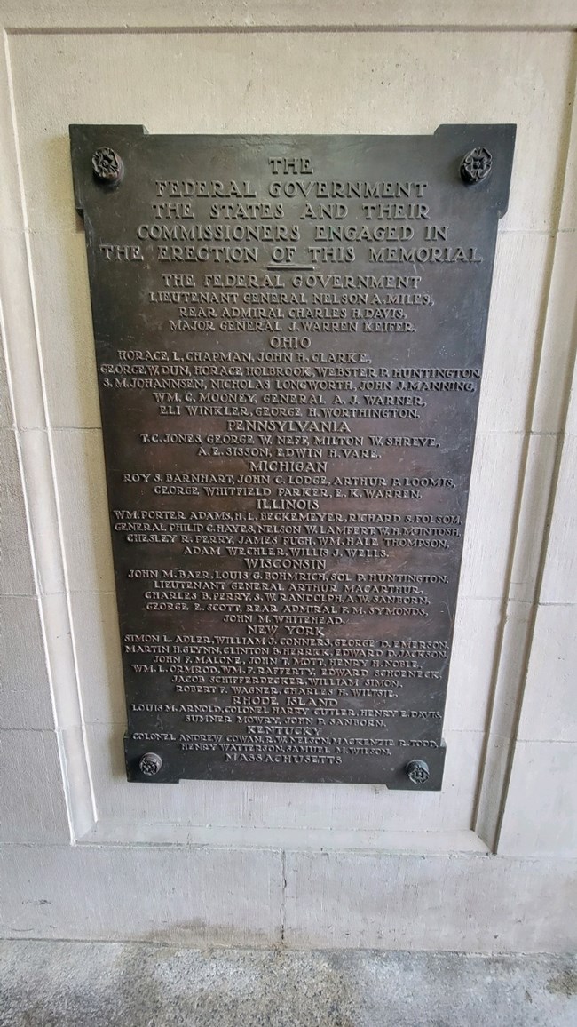 A bronze tablet listing the names of the states and their commissions who engaged in the erection of the Memorial