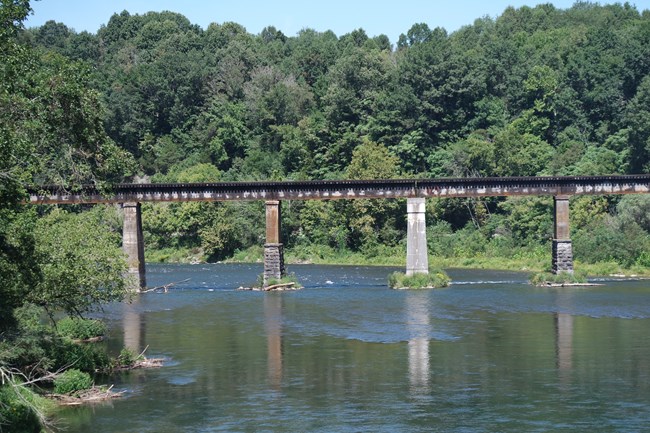 Train trestle crossing a river