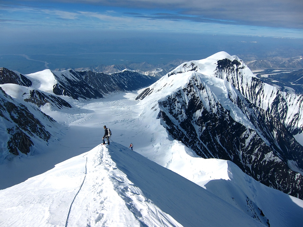 Climbers on Karstens Ridge looking out towards of the tundra north of Denali