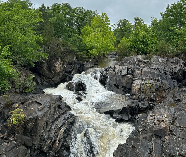 Rocky terrain with water rushing through it