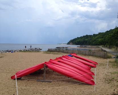 Kayaks ready to be rented at Westmoreland State Park along the beach