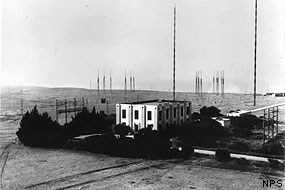 Marconi/RCA Bolinas Building 2. This view of Building 2, looking towards the Pacific Ocean, shows the building in its original form before the addition of Building 2A. Two of the famous Marconi 300ft. cylindrical pressed steel masts may be seen along with the H frames carrying the antenna feed lines. Building 1 is just out of view at the top right of the photo.