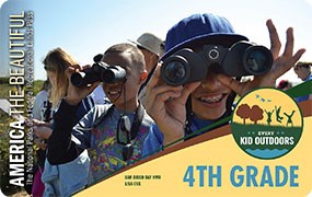 Image of the 2020–2021 Every Kid Outdoors Pass, featuring a photo of children looking through binoculars.