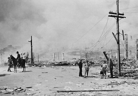 Signal Corps men repair lines after fire