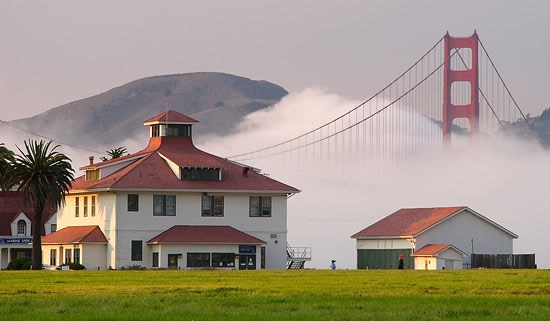 Fog entering the Golden Gate with Old Crissy Field Coast Guard Station in foreground