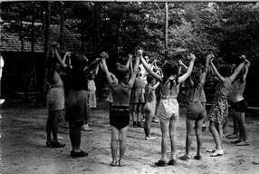 Children in a circle holding hands and playing games in Chopawamsic RDA in the 1930s.