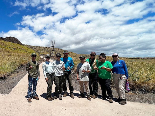 Group of interns posing for photo in front of heiau