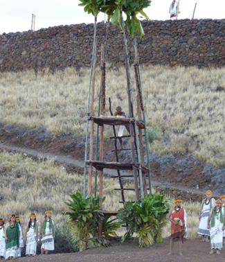 Offerings are placed on the Lele (offering tower) during the Ho'okupu ceremony.