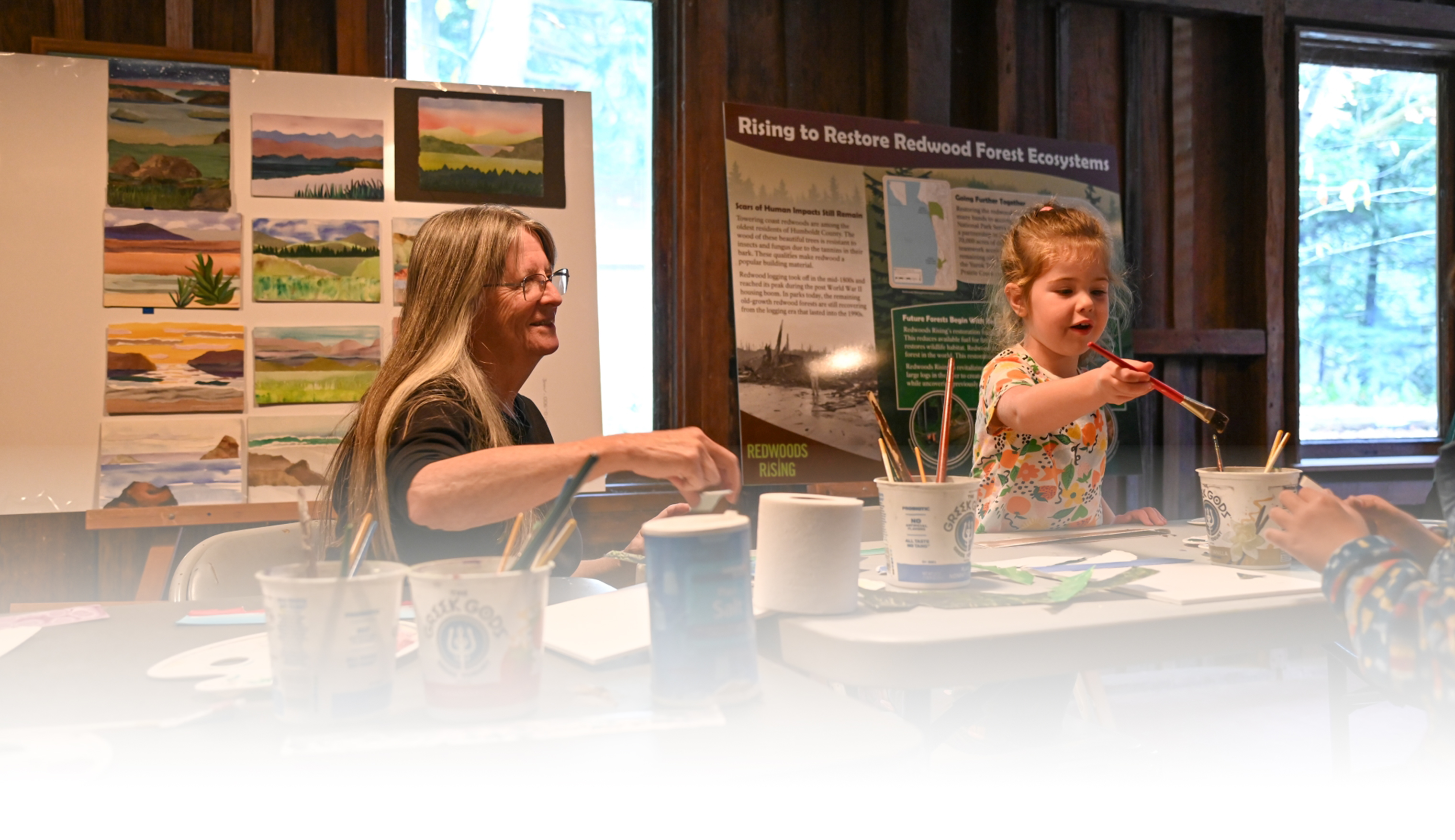 Maureen McGarry, 2024 Redwood Artist-in-Residence, holding a painting event in Prairie Creek Visitor Center.