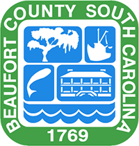 "Beaufort County, South Carolina, 1769" in a square around a shield of an oak tree, shrimp boat, fish, historic building, and waves.